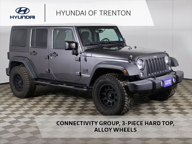 2016 Jeep Wrangler Unlimited Sport — photo 1 of 13